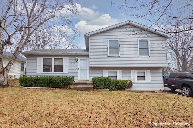 tri-level home featuring a front yard