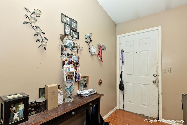 entryway with hardwood / wood-style flooring