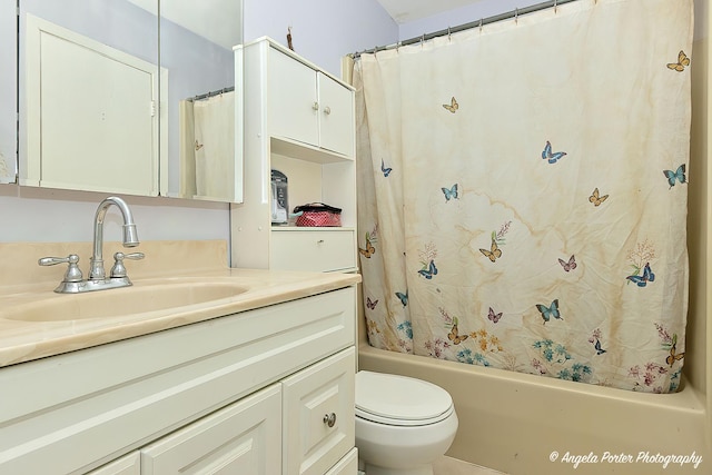 full bathroom with vanity, toilet, and shower / bath combo