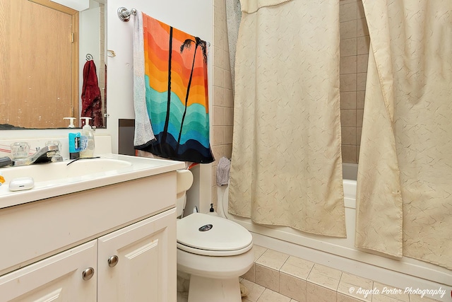 full bathroom featuring tile patterned flooring, vanity, shower / tub combo with curtain, and toilet