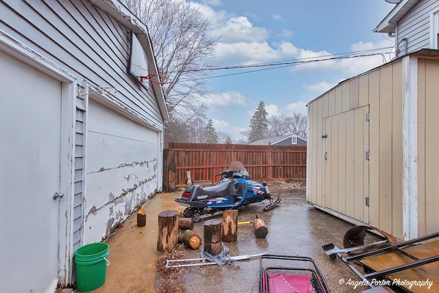 view of patio / terrace featuring a storage shed