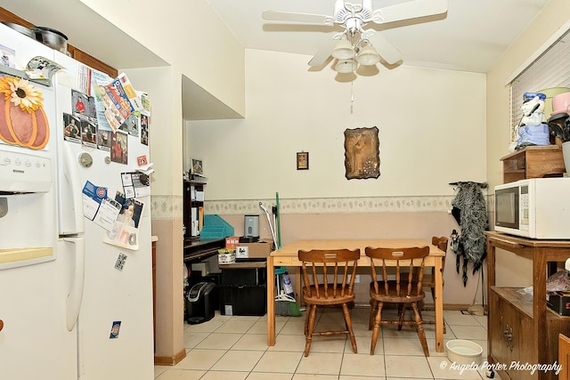 dining area with ceiling fan and light tile patterned flooring