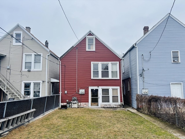 back of house featuring a yard