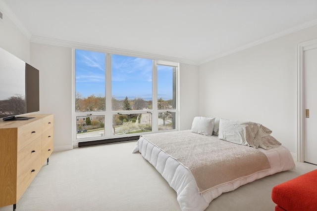 bedroom featuring light colored carpet, ornamental molding, baseboards, and visible vents