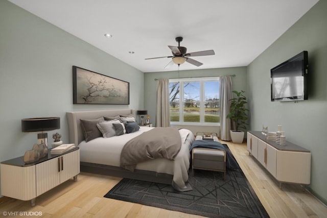 bedroom featuring ceiling fan and light hardwood / wood-style flooring