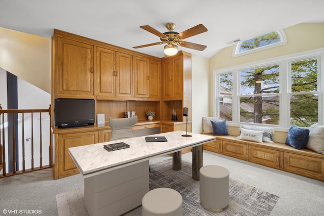 home office with ceiling fan, light colored carpet, and lofted ceiling