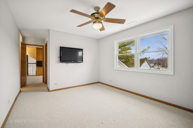 unfurnished bedroom with light carpet and ceiling fan