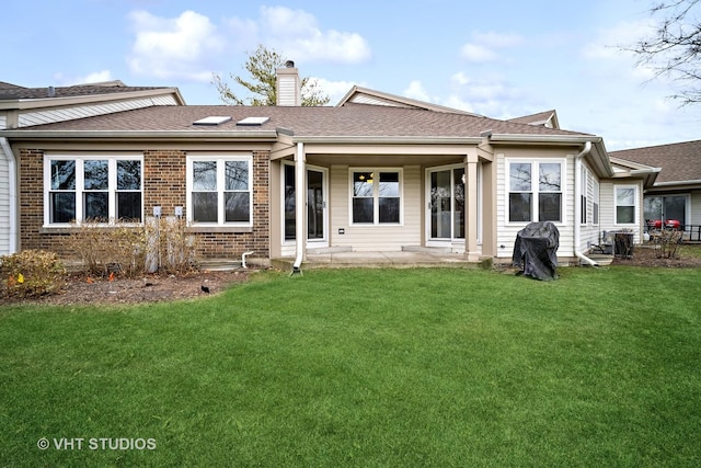 back of property featuring a yard and cooling unit