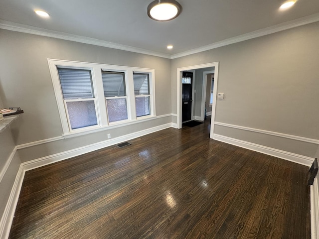 unfurnished room with crown molding and dark wood-type flooring