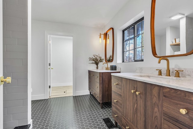 bathroom featuring tile patterned flooring and vanity