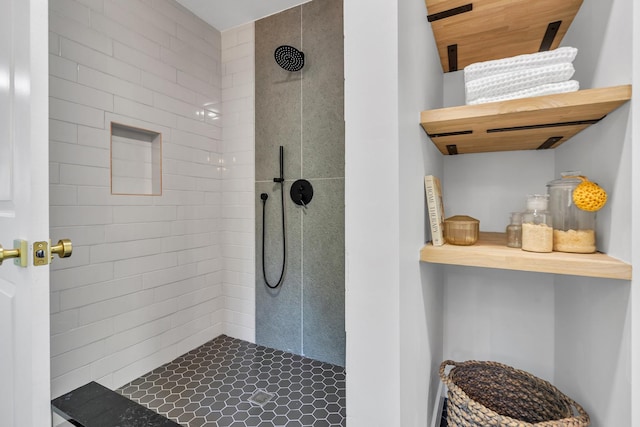 bathroom with tiled shower