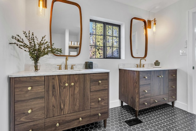 bathroom featuring tile patterned flooring and vanity