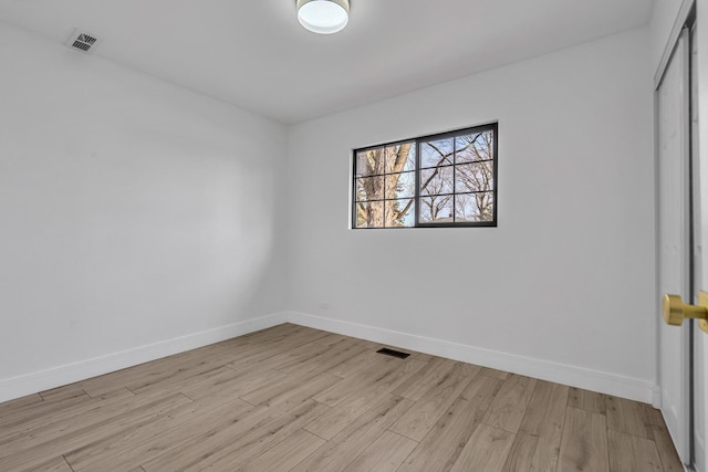 unfurnished room with light hardwood / wood-style floors