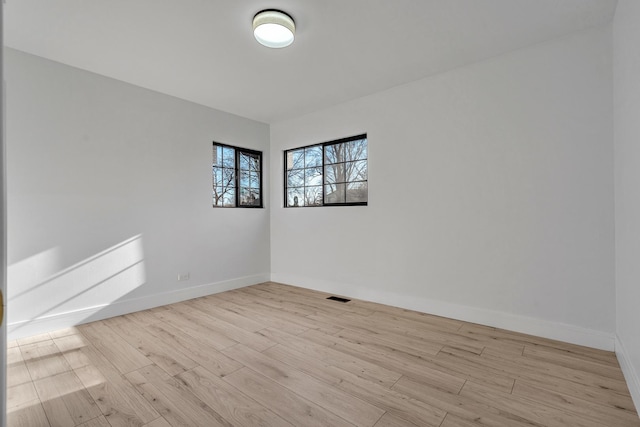 unfurnished room featuring light hardwood / wood-style flooring