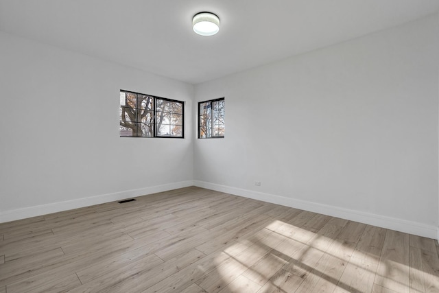 unfurnished room featuring light hardwood / wood-style flooring