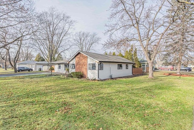 view of property exterior with a lawn