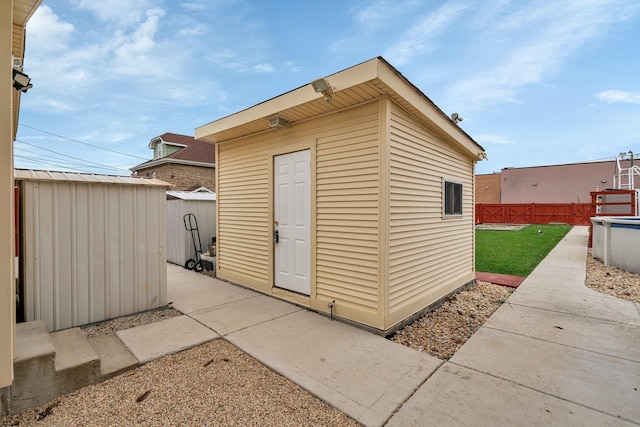 view of outdoor structure featuring a lawn