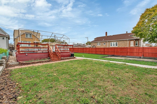 view of yard featuring a wooden deck