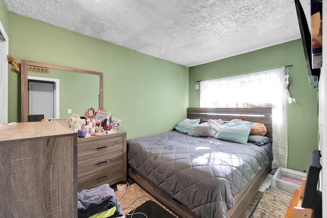 bedroom featuring a textured ceiling