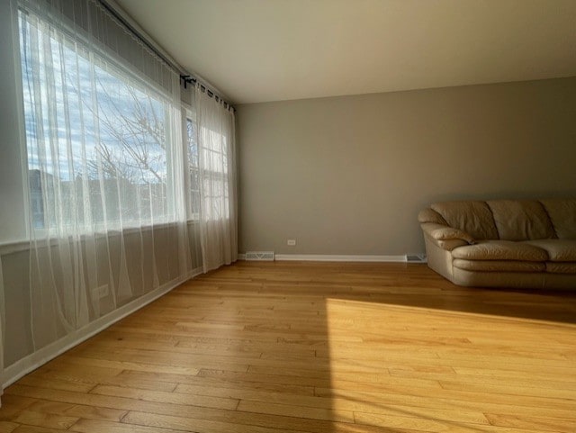 unfurnished living room featuring light hardwood / wood-style flooring