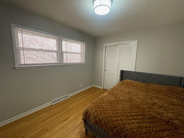 bedroom featuring a closet and light hardwood / wood-style floors