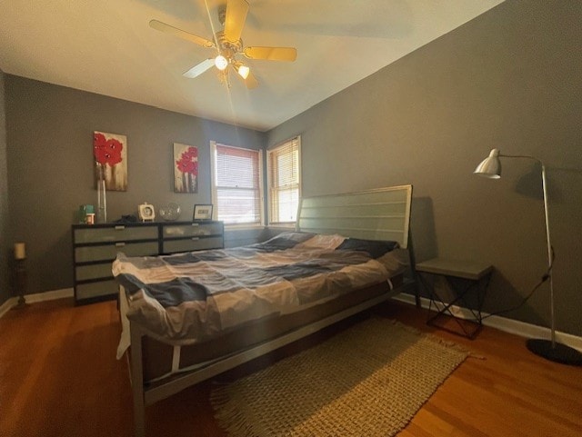 bedroom featuring hardwood / wood-style flooring and ceiling fan