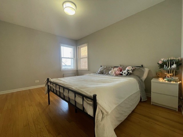 bedroom featuring hardwood / wood-style flooring