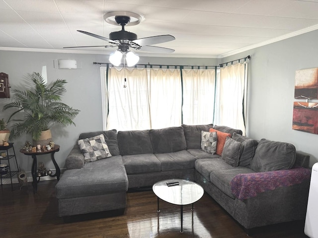 living room with dark hardwood / wood-style flooring, ceiling fan, and crown molding