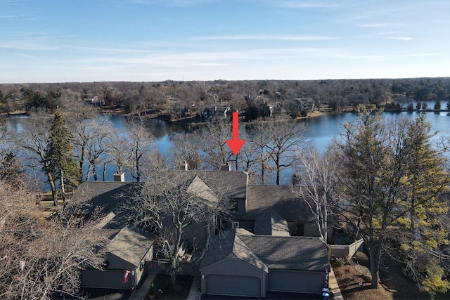 birds eye view of property with a water view