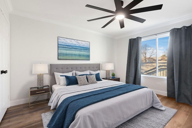 bedroom with wood-type flooring, ornamental molding, and ceiling fan