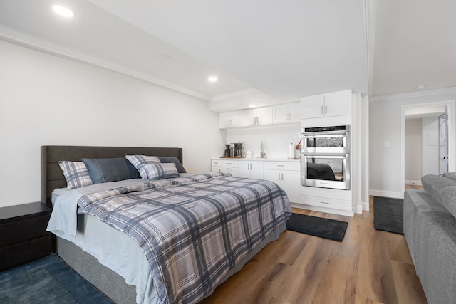 bedroom featuring ornamental molding and dark wood-type flooring