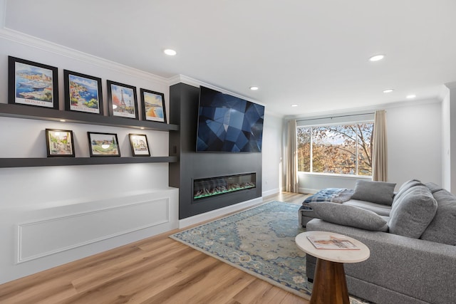 living room with crown molding and hardwood / wood-style floors