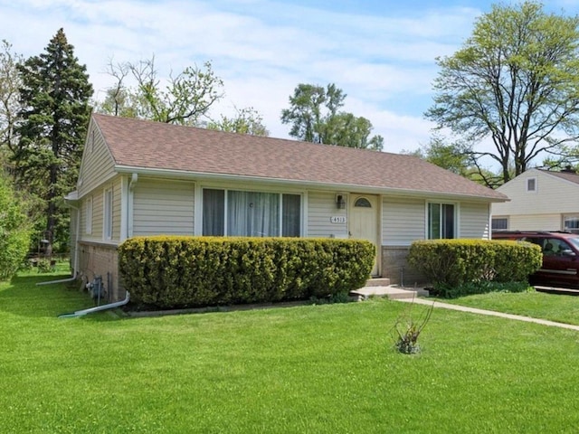 ranch-style house featuring a front lawn