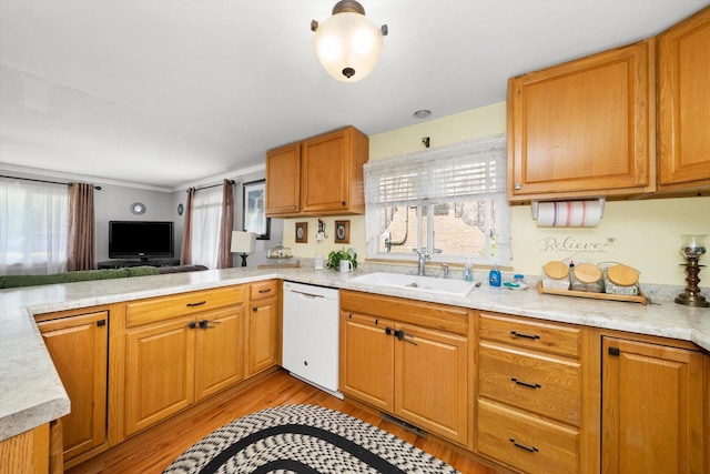 kitchen featuring kitchen peninsula, sink, white dishwasher, and light hardwood / wood-style floors