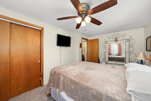 bedroom with light carpet, a closet, and ceiling fan