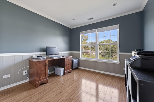 office area with light hardwood / wood-style flooring and ornamental molding