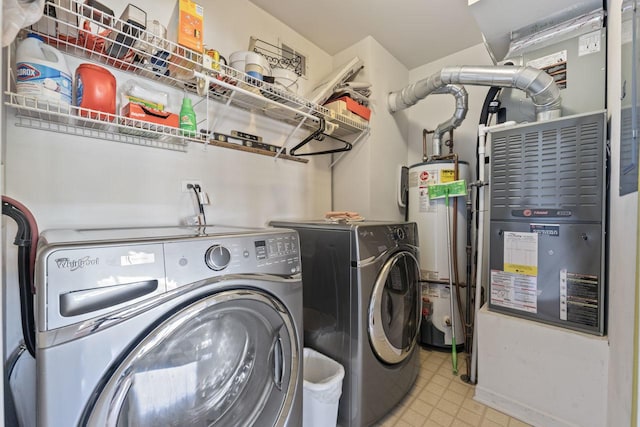 laundry room featuring washer and clothes dryer and water heater