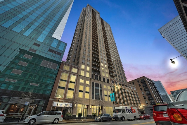 view of outdoor building at dusk