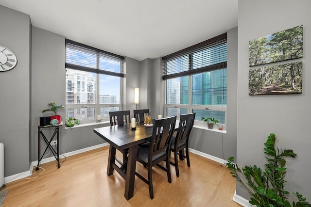 dining room with light wood-type flooring