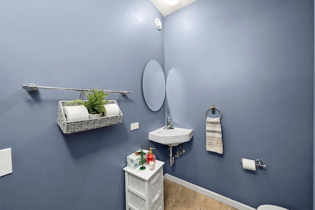 bathroom with tile patterned floors and sink