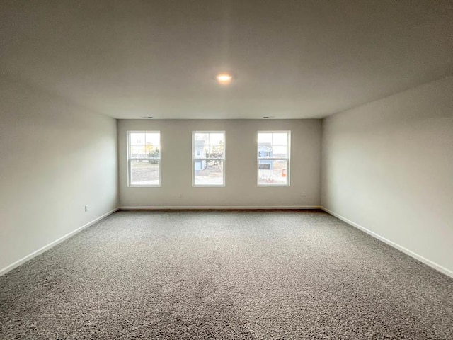 unfurnished room with carpet floors