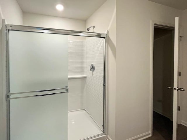 bathroom featuring an enclosed shower