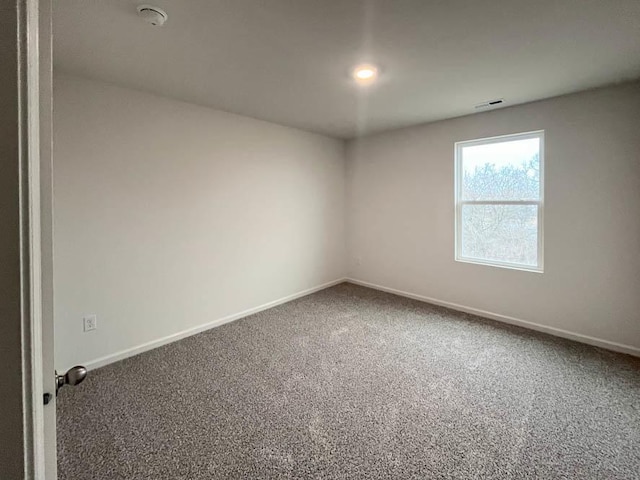 unfurnished room with carpet floors