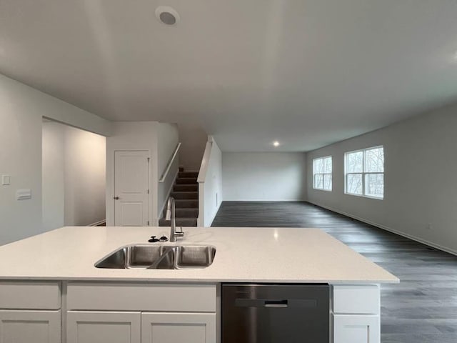 kitchen with sink, an island with sink, white cabinets, and dishwasher