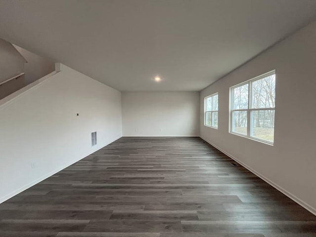 empty room with dark hardwood / wood-style floors