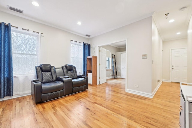 interior space with ornamental molding and light wood-type flooring