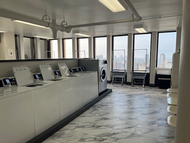 laundry area with independent washer and dryer