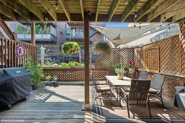 wooden deck featuring area for grilling