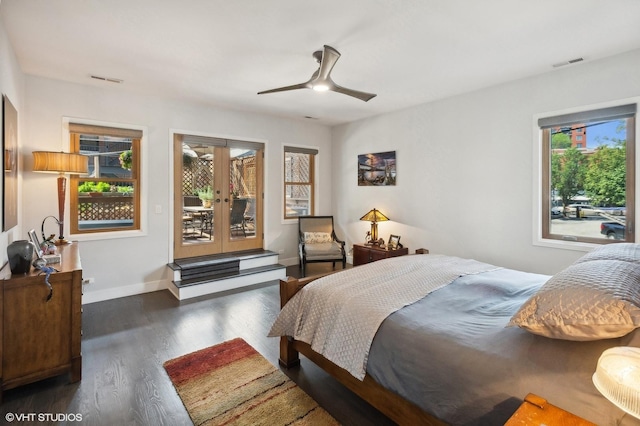 bedroom with ceiling fan, dark hardwood / wood-style floors, access to outside, and french doors