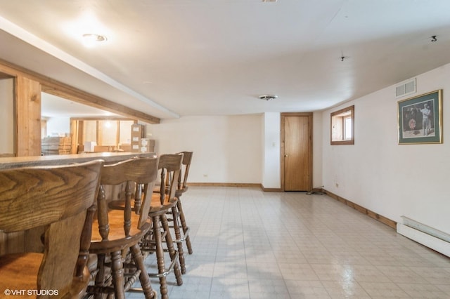 interior space featuring a baseboard heating unit